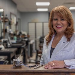 The Experience - Barber and Shave Company - Lisa D'Amico; is a master when it comes to using her straight razor. Book online to experience a straight razor shave for the first time.