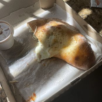 Roger's Pizzerolo - This is half of my calzone - Italian Near Me - El Cajon, California Roger's Pizzerolo - This is half of my calzone - Italian Near Me - El Cajon, California