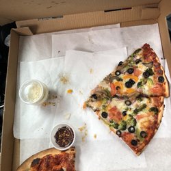 Carole's Mad Dog Restaurant & Saloon - It was an effort to pause long enough to take this picture there Veggie pizza is amazing!