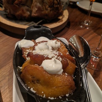 Leña Brava - Butter Roasted Plantains - Ripe plantains roasted in the wood oven with butter, thick cream, homemade fresh cheese. - Seafood Near Me - Chicago, Illinois