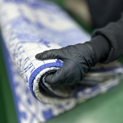Jenn's Wash & Fold - Folding a king size blanket with care.