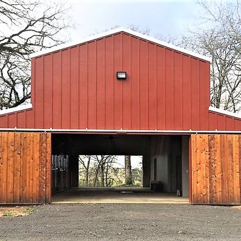 Sullivan Classic Homes - a red barn with a white roof - General Contractors Near Me - New Waverly, Texas Sullivan Classic Homes - a red barn with a white roof - General Contractors Near Me - New Waverly, Texas