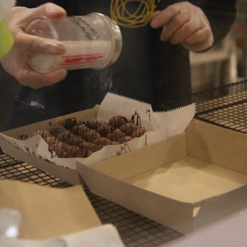 Ball Ball Waffle - a person pouring milk over a box of doughnuts - Hong Kong Style Cafe Near Me - Cleveland, Ohio Ball Ball Waffle - a person pouring milk over a box of doughnuts - Hong Kong Style Cafe Near Me - Cleveland, Ohio