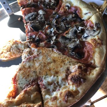 The Feast Restaurant - Pizza from the top - Seafood Near Me - Holmes Beach, Florida The Feast Restaurant - Pizza from the top - Seafood Near Me - Holmes Beach, Florida