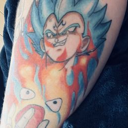 Healed after 6 months Dragon Ball and Howls Moving castle tattoo done