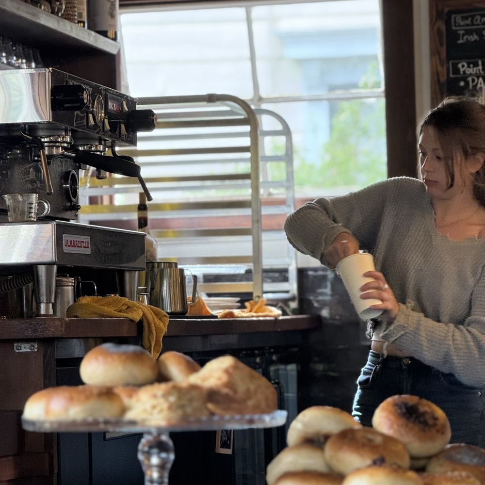 Behind the counter. The fresh baked bagels and bialys look dense and delicious