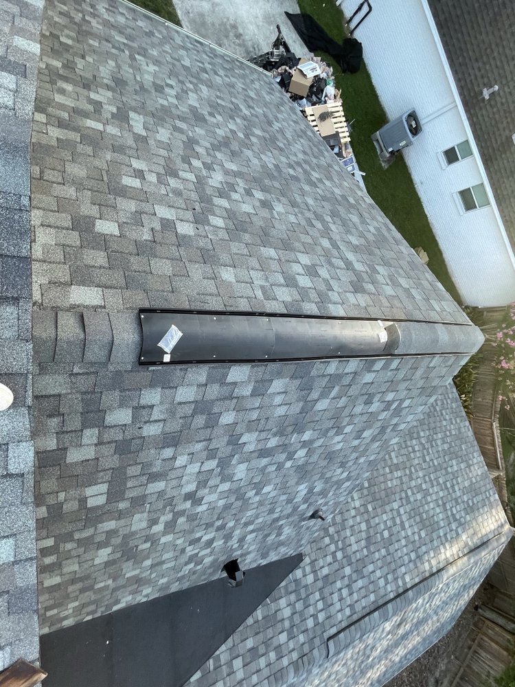 Slide of Dacoma Roofing