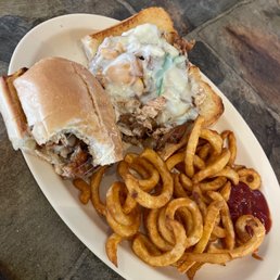 Chicken Philly Cheese Steak Sandwich and curly fries are delicious Chicken Philly Cheese Steak Sandwich and curly fries are delicious