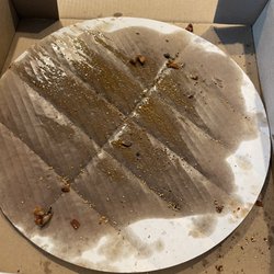 Massey's Pizza Sports Bar & Wings - Grease on cardboard because of excessive wait time in the store.