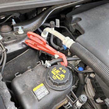 Roadrunner Express Lube - The massive clamp they left on my coolant line that led to this nightmare. - Oil Change Stations Near Me - Melbourne Village, Florida Roadrunner Express Lube - The massive clamp they left on my coolant line that led to this nightmare. - Oil Change Stations Near Me - Melbourne Village, Florida