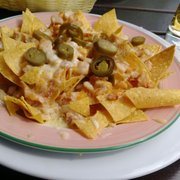 Foto zu Steakhaus Angus - Berlin, Deutschland. Nachos mit Hähnchen überbacken.