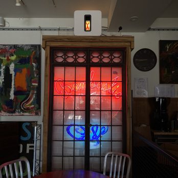 Bombastic Cafe - a red and blue neon sign - Coffee & Tea Near Me - Chicago, Illinois
