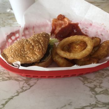 Roy's Squeeze Inn - Little Squeeze with cheese, very flavorful and delicious, so are the seasoned wedge fries and onion rings. - Burgers Near Me - Ypsilanti, Michigan