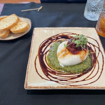 Delaney's Tavern - Burrata- yummy liquid cheese inside and tasty chimichurri drizzled with sweet sauce! - New American Near Me - Orlando, Florida