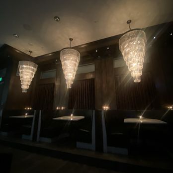 Hattie's Cocktails - chandeliers in a dimly lit room - Cocktail Bars Near Me - Rochester, New York