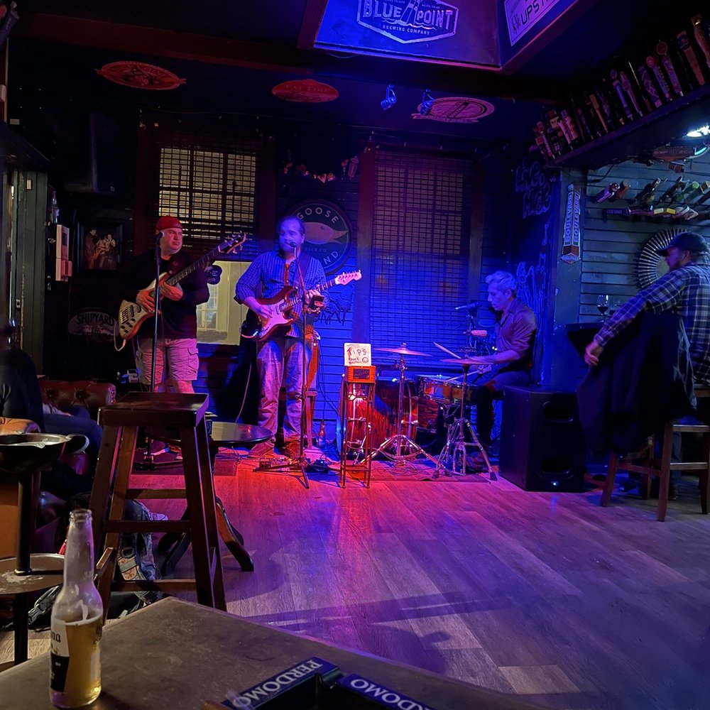 Stogies Cigar Bar - band playing on stage - Jazz & Blues Near Me - Saint Augustine, Florida Stogies Cigar Bar - band playing on stage - Jazz & Blues Near Me - Saint Augustine, Florida