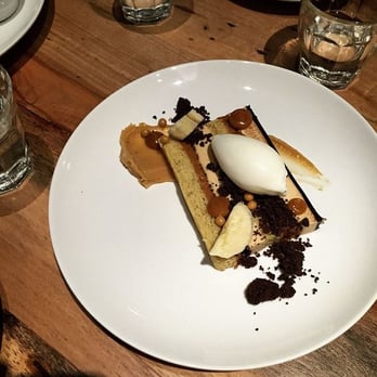 Launderette - Hazelnut layer cake with bananas, praline and sour cream ice. - New American Near Me - Austin, Texas Launderette - Hazelnut layer cake with bananas, praline and sour cream ice. - New American Near Me - Austin, Texas