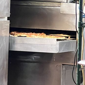 Pizza Hut - a pizza being taken out of the oven - Pizza Near Me - Batesburg-leesville, South Carolina Pizza Hut - a pizza being taken out of the oven - Pizza Near Me - Batesburg-leesville, South Carolina