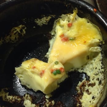 Pine Tree Korean BBQ Restaurant - Here's the egg (costs $2 with the AYCE).  The orange stuff is not cheese- it's uncooked egg.  I don't recommend ordering this. - Korean Near Me - Northridge, California