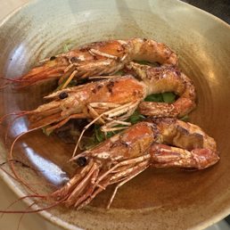 Prawns wrapped in bacon fat.