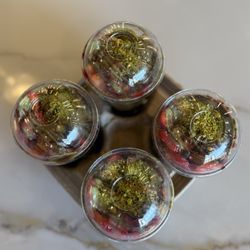 Pistachio Sweets - Overhead view of a four pack of Dubai chocolate with strawberries in a cup.