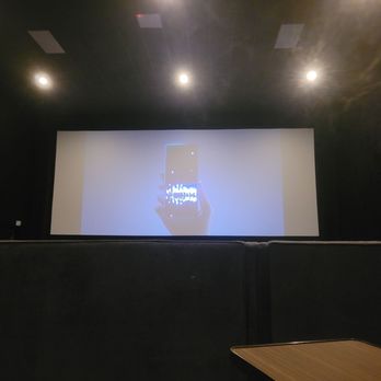 Star Cinema Grill - Taken at my eye level. This is a regular seat behind a row of pod seats. If you're short don't recommend. - Dinner Theater Near Me - Houston, Texas
