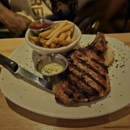 Pork chop was tender, juicy and very flavorful. Pork chop was tender, juicy and very flavorful.