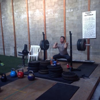 Stronger Training - Coach Danny squatting while I lift some Kettlebells - Trainers Near Me - Pasadena, California