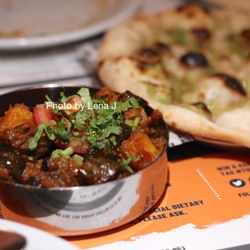 Tuk Tuk Indian Street Food - Baby Aubergine & Potato (£7.35) + Garlic Naan (£3.70) - seasoned aubergine and potato mixed with warm cumin & masala spices