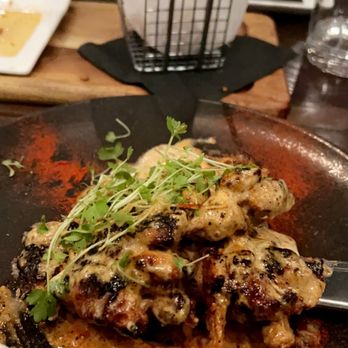 Carson Kitchen - Chicken thighs, crispy chicken skins, brownie - New American Near Me - Salt Lake City, Utah
