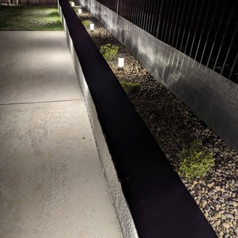 Caligreen Landscaping - Path lights behind the seating wall - Landscaping Near Me