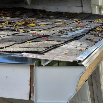 The Rain Man - Leaf filter is too long and goes deep into the shingles. As a result, it's being pushed up. Unsecured leaf filter. - Gutter Services Near Me - Grapevine, Texas The Rain Man - Leaf filter is too long and goes deep into the shingles. As a result, it's being pushed up. Unsecured leaf filter. - Gutter Services Near Me - Grapevine, Texas