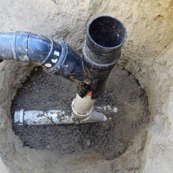 Water Wise Plumbing, Backflow & Drains - Sewer pipe in front lawn showing misfit of Tee and vertical pipe of wrongly thin material cracked and had root ingress. - Plumbing Near Me - Oceanside, California Water Wise Plumbing, Backflow & Drains - Sewer pipe in front lawn showing misfit of Tee and vertical pipe of wrongly thin material cracked and had root ingress. - Plumbing Near Me - Oceanside, California