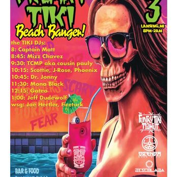 The Funky Tiki - a woman holding a drink - Tiki Bars Near Me - Lansing, Michigan The Funky Tiki - a woman holding a drink - Tiki Bars Near Me - Lansing, Michigan