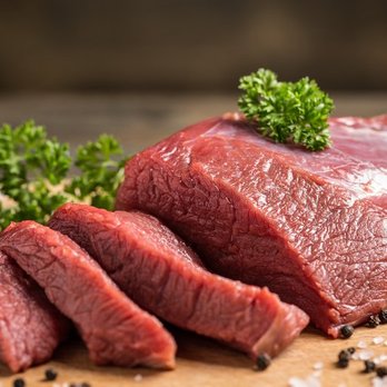 The Meat Corner - a piece of beef on a cutting board - Meat Shops Near Me - Sunnyvale, California