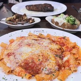 Chicken parmigiana over rigatoni with vodka sauce