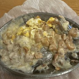 Fried potatoes, egg over medium covered in sausage gravy!!! Fried potatoes, egg over medium covered in sausage gravy!!!
