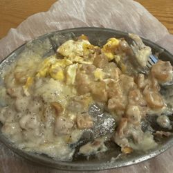 Tequila Grill & Cantina - Fried potatoes, egg over medium covered in sausage gravy!!!