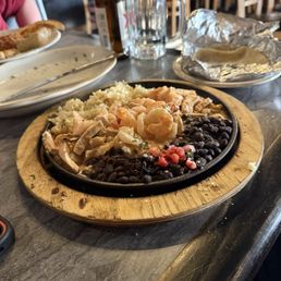 Chicken & shrimp in cream sauce, rice and black beans. Chicken & shrimp in cream sauce, rice and black beans.