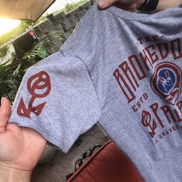 a person holding a t - shirt a person holding a t - shirt