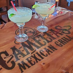 two margaritas on a table