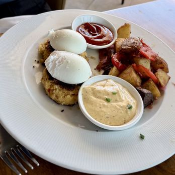 The Strand House - Crab Cakes Eggs Benedict--two poached eggs served on lump crab cakes with oven roast potatoes--- excellent. - Venues & Event Spaces Near Me - Manhattan Beach, California The Strand House - Crab Cakes Eggs Benedict--two poached eggs served on lump crab cakes with oven roast potatoes--- excellent. - Venues & Event Spaces Near Me - Manhattan Beach, California