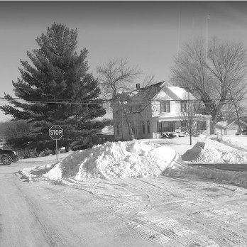 Hy-Vee - a black and white photo of a snow covered street - Grocery Near Me - Denison, Iowa