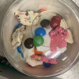a plastic cup filled with candy a plastic cup filled with candy