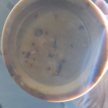 Donut Basket - Bottom of my Vietnamese Iced Coffee. You can see the sugar along with the condensed milk. It was good. - Donuts Near Me - Milpitas, California