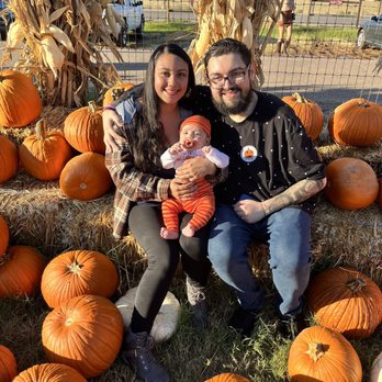 Mother Nature's Farm - Family picture in the photo area with all the pumpkins in the front. - Farms Near Me - Gilbert, Arizona Mother Nature's Farm - Family picture in the photo area with all the pumpkins in the front. - Farms Near Me - Gilbert, Arizona