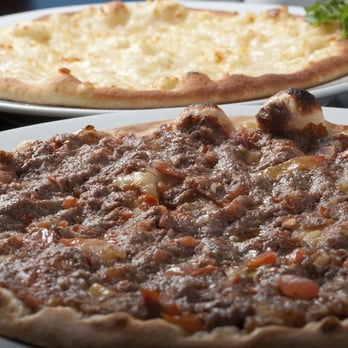 Palm Palace - two pizzas on a table - Middle Eastern Near Me - Mississauga, Ontario Palm Palace - two pizzas on a table - Middle Eastern Near Me - Mississauga, Ontario