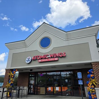Atomic Wings Roanoke - The Atomic Wings building under a beautiful blue sky with white clouds. - Chicken Wings Near Me - Roanoke, Virginia Atomic Wings Roanoke - The Atomic Wings building under a beautiful blue sky with white clouds. - Chicken Wings Near Me - Roanoke, Virginia