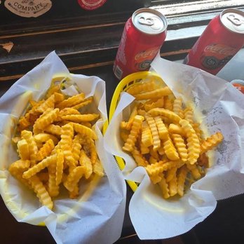 Buster's Cheesesteak - Regular fries & garlic fries. - American Near Me - San Francisco, California