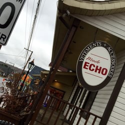 Mode Echo - Sign out front on a rainy day just before opening time.